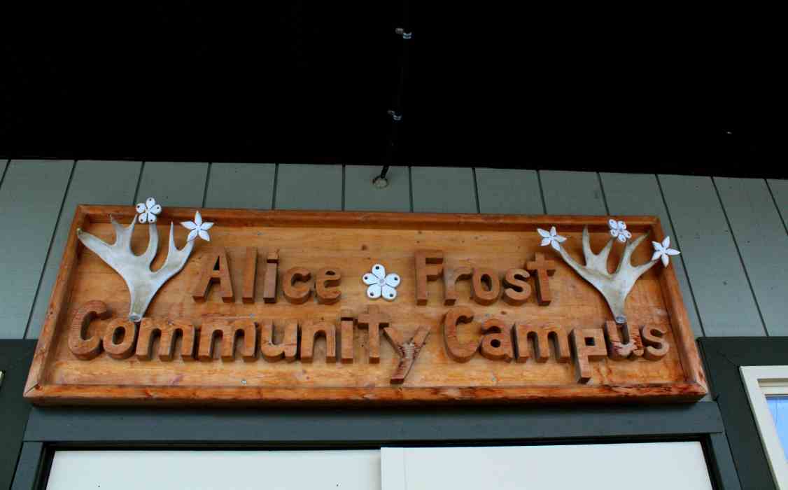 Wood sign adorned with antlers that reads "Alice Frost Community Campus"