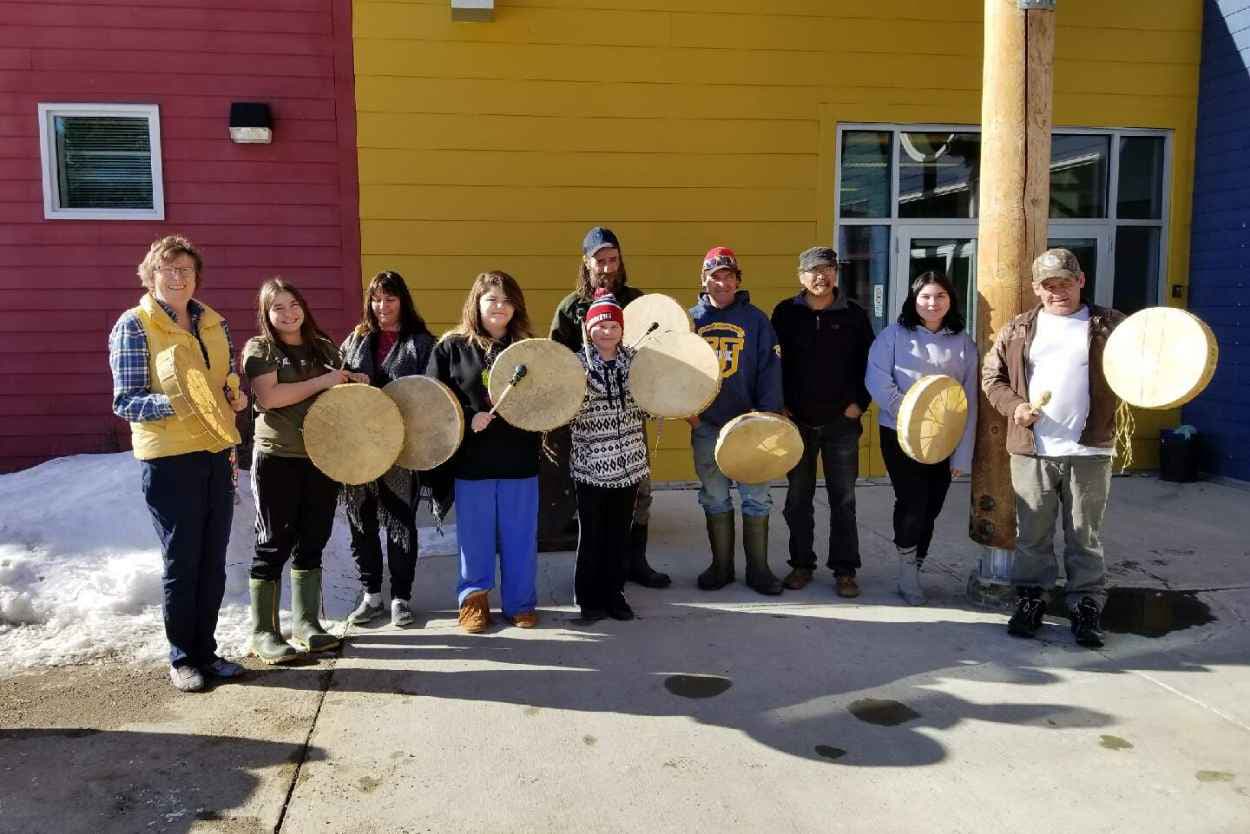 Participants holding their completed drums after taking a drum making course at the Mayo Campus