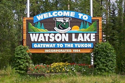 Wood sign that reads Welcome to Watson Lake, Gateway to the Yukon, incorporated 1984