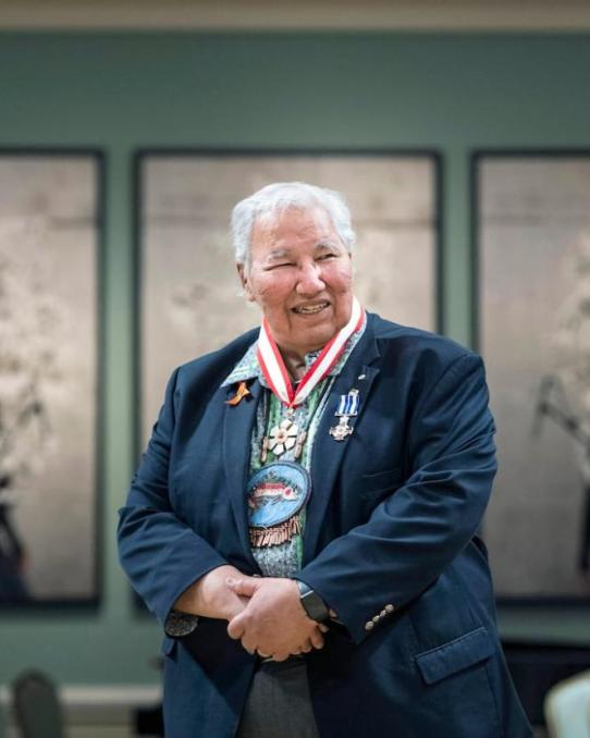 Image of Justice Murray Sinclair, an Indigenous Elder wearing beaded medallion and wearing suit.